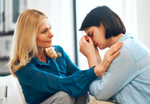 senior comforting woman