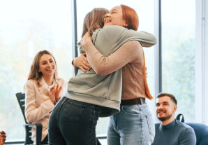 two woman hugging