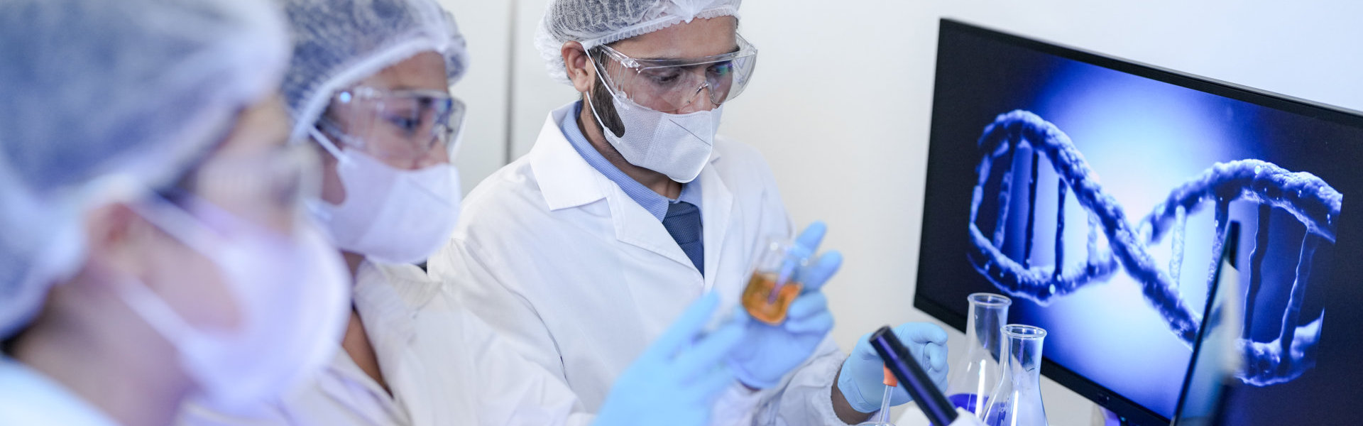 A team of scientists in a modern laboratory meticulously works o